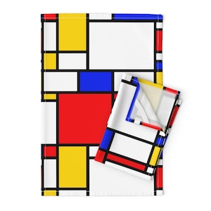 May include: A kitchen towel with a geometric pattern of red, yellow, blue, and white squares. The pattern is reminiscent of a famous abstract painting.
