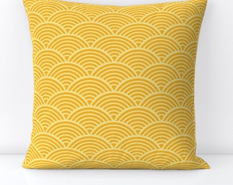 May include: A yellow throw pillow with a geometric pattern of overlapping semi-circles.
