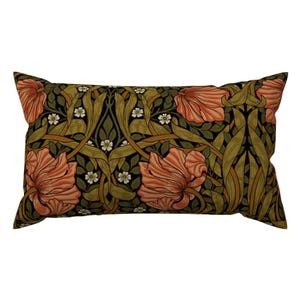 May include: A rectangular pillow with a floral pattern. The pillow features a dark green background with orange flowers and white accents.