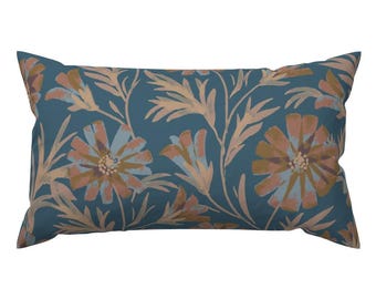 May include: Rectangular decorative pillow with a teal background and a floral pattern. The flowers are in shades of peach, light blue, and tan. The pillow has a classic shape, perfect for a sofa or bed.