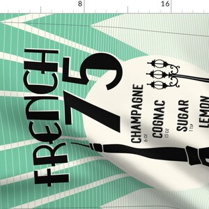 May include: Black and white graphic design with the text "FRENCH 75" on a teal and white striped background. The graphic also includes a list of ingredients for the cocktail, including champagne, cognac, sugar, lemon, and juice.