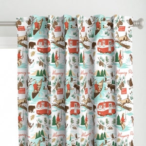 May include: A white fabric with a repeating pattern of red and blue vintage campers, moose, pine trees, and people fishing in canoes. The text "Whispering Pines" and "Bait Shop" is repeated throughout the pattern.