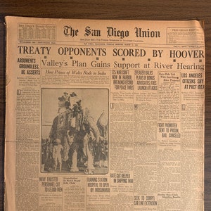 May include: A vintage newspaper, "The San Diego Union," from March 22, 1921, with headlines like "Treaty Opponents Scored by Hoover" and "How Prince of Wales Rode in India." The paper is aged with visible wear and tear, featuring various articles and advertisements.