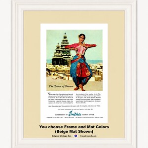 May include: A framed vintage advertisement featuring a dancer in a pink and blue sari performing in front of an ancient stone temple. The text reads The Dance of Bharata and includes information from the Government of India Tourist Office.