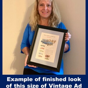 May include: Framed vintage advertisement with a black frame. The ad features a blue car and text that reads "Seats a whole baseball team beautifully?" The bottom of the image has the text "Example of finished look of this size of Vintage Ad".