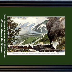 May include: Framed vintage print of a train crossing a bridge in a mountain landscape. The artwork features a black frame and a forest green mat. The image includes text that reads "Following Covered Wagon Trails, Locomotives Pull Tanks, Supplies, Soldiers across the Divide."