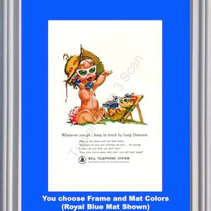 May include: Framed vintage advertisement for Bell Telephone System. The image features a cartoon baby wearing sunglasses and a hat, holding a phone. A teddy bear is in a beach chair. Text reads "Wherever you go...keep in touch by Long Distance."