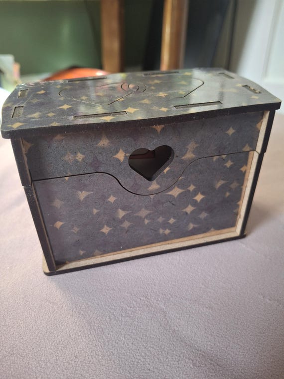 Hand-carved wooden box with a planchette lid and star pattern — actual witchy altar vibes, not mass-produced.