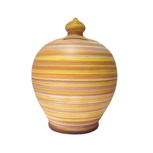 May include: A yellow, orange and brown striped ceramic money box with a rounded shape and a small lid.