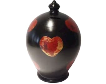 Hucha inusual, hucha oculta, bote de dinero con corazones