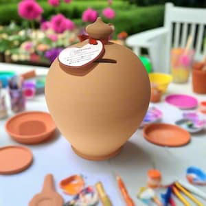 May include: A set of three ceramic vases in varying sizes and shapes. The vases are glazed in a matte white finish, with a textured surface. The tallest vase is approximately 25 cm tall.