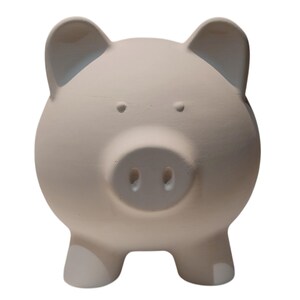 May include: A white ceramic mug with a black handle and the text "But First, Coffee" in a black, bold font. The mug is on a white surface.