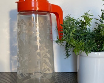 Retro Juice Tang Carafe with Red / Orange Lid and Etched Lilies