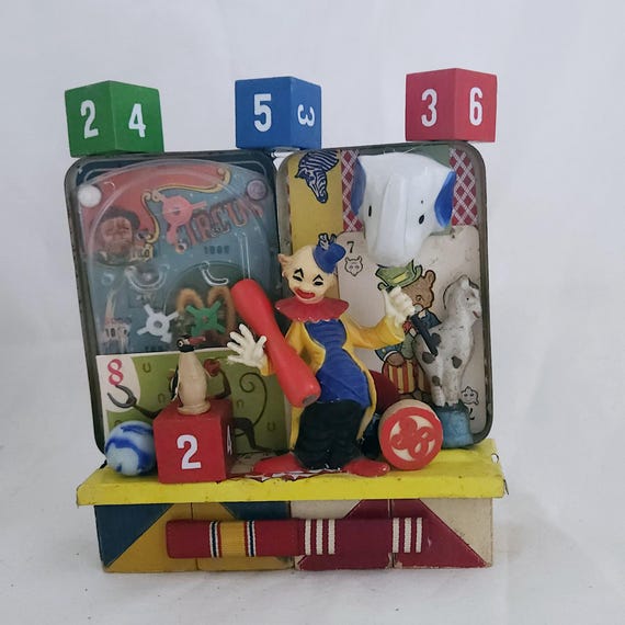 Circus Inspired Assemblage,Kitschy,Colorful Toys and Fun Objects In Repurposed Tin