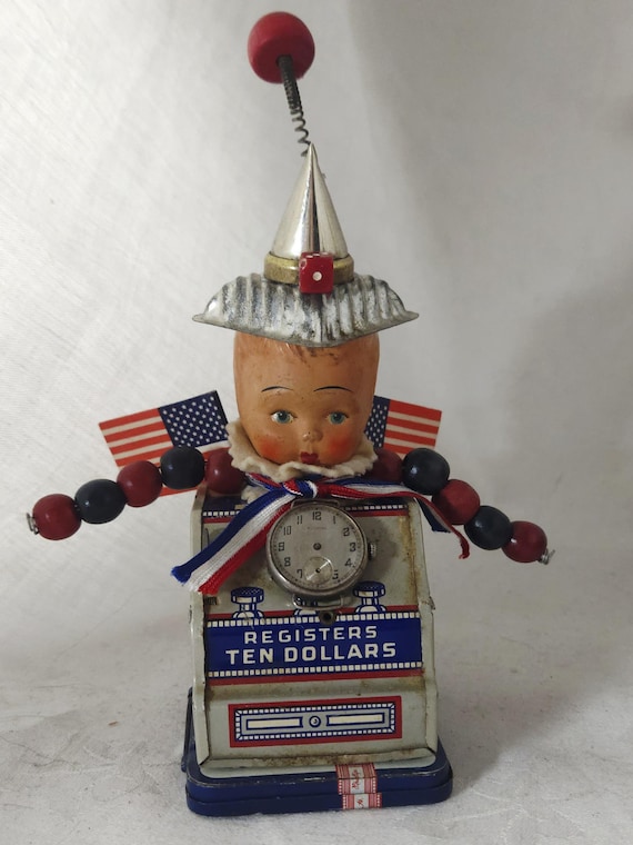 Little YANKEE DOODLE Assemblage,Altered Doll On Tin Bank,Patriotic, Red,White,And Blue,Whimsical One Of A Kind
