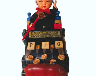 Repurposed Vintage Toy Cash Register, Doll Head ,Pig Assemblage BANK on IT
