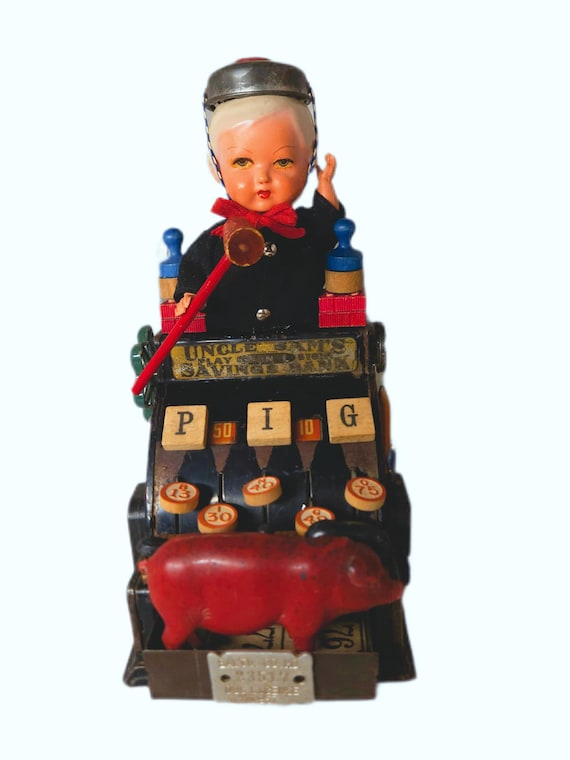 Repurposed Vintage Toy Cash Register, Doll Head ,Pig Assemblage BANK on IT