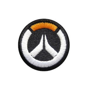 May include: A black and white embroidered patch featuring the Overwatch logo. The logo is a white circle with a white stylised 'W' inside. The circle has a yellow and orange arc at the top.