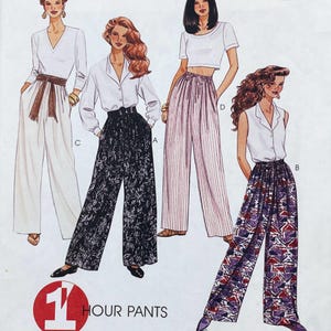 May include: A sewing pattern illustration titled 1 HOUR PANTS featuring four variations of wide-leg trousers. Designs include solid cream with a sash, black with white floral print, light pink with vertical stripes, and a purple geometric pattern.