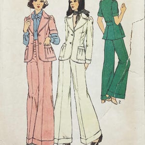 May include: A vintage sewing pattern illustration featuring three outfits: a pink blazer and trousers set with a blue blouse, a white blazer and trousers set with a neck scarf, and a green short-sleeved jacket with matching wide-leg trousers labelled with the number 2.