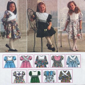 May include: A vintage sewing pattern featuring three young girls in dresses, with a selection of dress designs below. The dresses have various floral and patterned fabrics, with details like puff sleeves and contrasting collars. The pattern is for children's clothing.