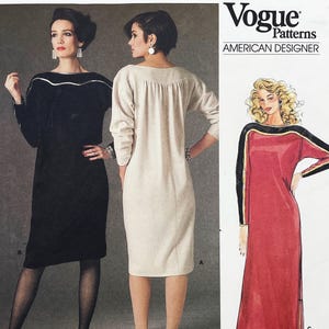 May include: Vogue Patterns American Designer sewing pattern envelope featuring illustrations of three dress variations. One dress is black, one is off-white, and one is red with black sleeves. Each dress has long sleeves and a distinct curved neckline detail.
