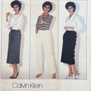 May include: A sewing pattern illustration featuring three outfits by Calvin Klein. The designs include a grey pinstriped skirt with side buttons, a striped short-sleeve top with cream trousers, and a black skirt with side buttons paired with a white blouse.