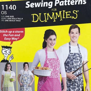 May include: A sewing pattern book titled "Sewing Patterns For Dummies" with the number 1140. The cover features a couple wearing aprons. The woman's apron is pink with a floral pattern, and the man's is gray camouflage.