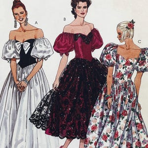May include: Three fashion illustrations of dresses labeled A, B, and C. Dress A is black and white with puff sleeves and a bow. Dress B is deep magenta with black lace overlay and puff sleeves. Dress C is white with a red rose floral print and puff sleeves.