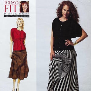 May include: A sewing pattern for a woman's top and skirt. The pattern includes a red top with buttons and a brown skirt with a floral design. The model is wearing a black top and a black and white striped skirt. The text on the pattern reads "Today's Fit" by Sandra Betzina.