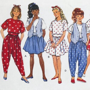 May include: Vintage sewing pattern featuring four different outfits. The outfits include a red star-printed jumpsuit, a blue skirt with a striped vest, a white polka-dot dress, and blue polka-dot pants with a striped vest. Each outfit is paired with a matching headband.