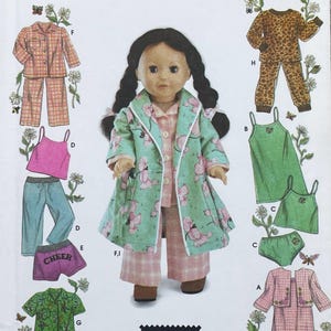May include: A doll with dark braided hair wears a light green coat with a pink poodle pattern over a pink plaid pajama set. The image includes various clothing illustrations labeled with letters, including plaid pajamas, a leopard print set, and green tank tops.