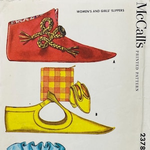 May include: A McCall's printed pattern envelope for slippers, labelled WOMEN'S AND GIRLS' SLIPPERS and 2378. The illustration shows a red slipper with gold braided ties and a yellow slipper with a matching yellow pouch and small yellow shoes.