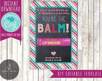 May include: A printable Valentine's Day card with a chalkboard background. The card features the text "Valentine, you're the BALM!" with a pink and teal striped border. The card also includes a pink and white Lip Smacker lip balm with the text "PIÑA COLADA LIP SMACKER" and the name "sienna".