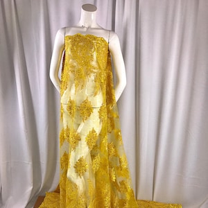 Yellow floral design embroidery and hand beaded with beads and shiny sequins on a yellow pattern mesh lace-dresses-fashion-sold by the yard.