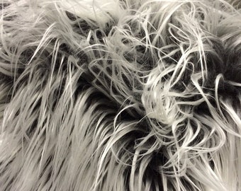 Gray/silver frost Mongolian fake fur.3 inch pile.36x60 inches. Sold by the yard.