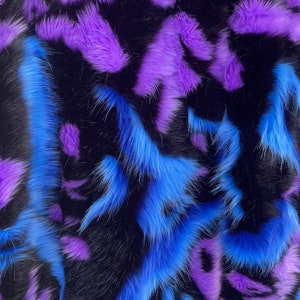 Purple/blue faux fur, animal shaggy faux fur. Sold by the yard.60&quot; wide.