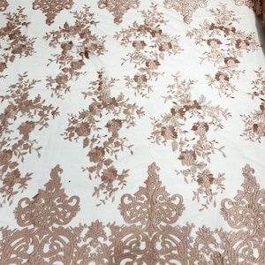 Floral flat lace embroider on a 2 way stretch mesh sold by the yard. Blush Pink