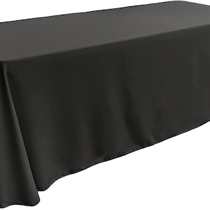 May include: A black rectangular tablecloth with a smooth, wrinkle-free surface. The tablecloth is draped over a table and has a slight overhang on all sides.