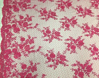 May include: Pink floral embroidered lace fabric with a dotted background. The lace features delicate floral designs and a subtle shimmer.