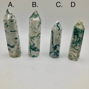 May include: Four green and white agate crystal points labeled A, B, C, and D. The points are arranged in a row from left to right.