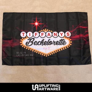 May include: Black and red Vegas-style sign with the text "Tiffany's Bachelorette" and the date "05.02.19 LAS VEGAS, NV".
