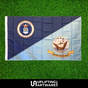 May include: A blue and light blue flag with the United States Air Force seal on the left side and the United States Navy seal on the right side.