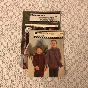 May include: Two vintage knitting pattern books from Woolworth. The first book is titled "Knitting for Youngsters" and the second book is titled "Double Knitting". Both books feature children wearing knitted garments.