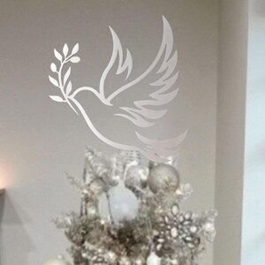 Celebrate the season with our artisan-cut silver dove tree topper—symbolizing peace, hope, and renewal, it’s the perfect finishing touch for your holiday decor. Crafted from durable metal with a sleek matte finish, this elegant piece doubles as wall art after the holidays, making it a meaningful gift or heirloom-worthy accent for any winter celebration. Can also be mounted on poles or posts outdoors for christmas decor.. Valentine gift idea present.