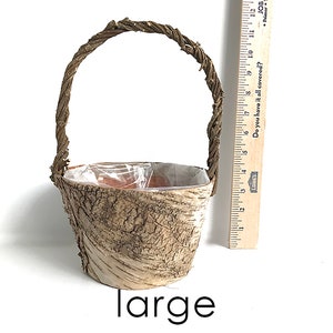 May include: A large, brown, bark-covered planter with a woven handle. The planter is 6 inches tall and is labeled "large".
