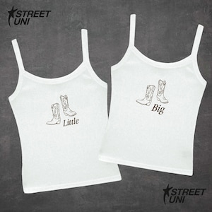 May include: Two white tank tops with spaghetti straps. Each top features a pair of cowboy boots in a brown outline. One top says "Little" and the other says "Big" below the boot design. The Street Uni logo is in the upper left and lower right corners.
