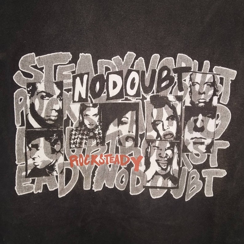 May include: Black and white graphic print of a band called "No Doubt" with the words "RockSteady" printed below. The band members are in black and white and are arranged in a grid pattern. The background is black.