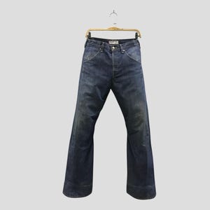 Vintage des années 90 Levi's Engineered Jeans Wide Leg Flare Indigo Denim Trouser Levi Strauss Jean Button Fly Light Washed Denim Jeans Levi's W30