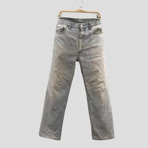 May include: A set of three ceramic mugs with a speckled, matte finish. The mugs are in shades of cream, light gray, and dark gray. Each mug has a simple, modern design and a rounded handle. Perfect for coffee or tea.